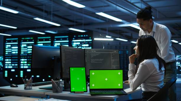 istock Engineers in data center monitoring security threats using chroma key devices 2165850601