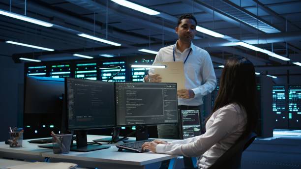 istock Teamworking colleagues in data center ensuring compliance with regulations 2165852710