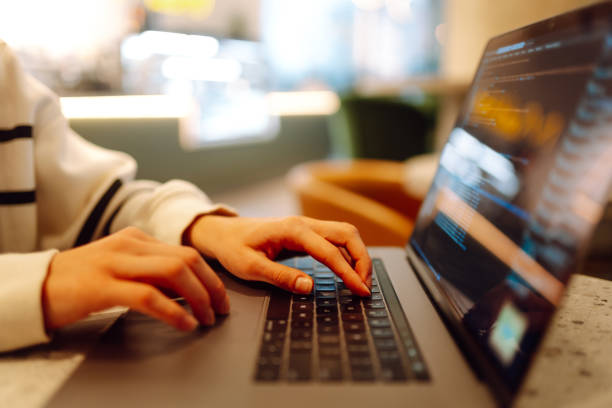 istock Close-up of hands working on a laptop keyboard. 2165852842