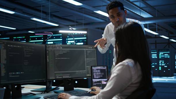 istock Engineering team colleagues in data center managing gear energy consumption 2165852872