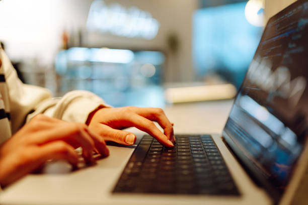 istock Close-up of hands working on a laptop keyboard. 2165852879