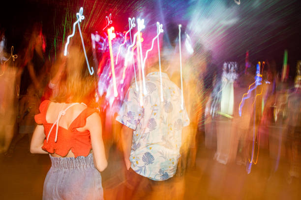 Two children having fun at evening party on holiday