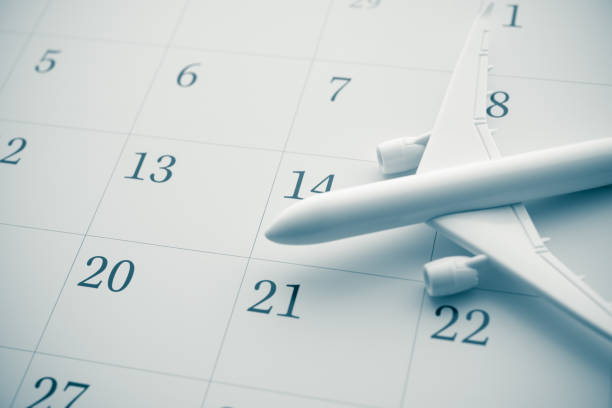 istock Airplane on white blank calendar copy space in monochrome. 2165855163