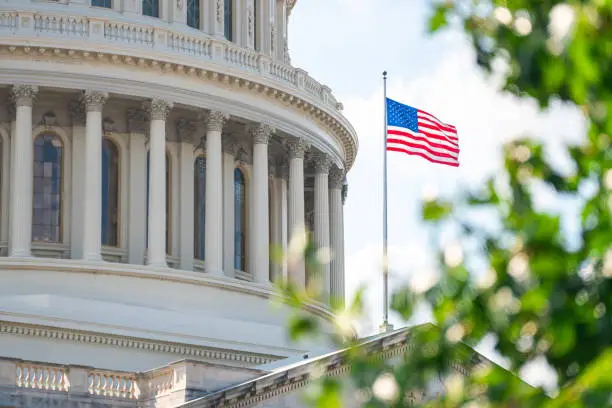 Close-up view of the American Flag on the U.S. Capitol building in Washington D.C. on the East Facade Close-up view of the American Flag on the U.S. Capitol building in Washington D.C. on the East Facade