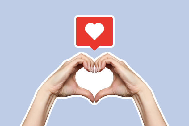 istock Woman hands making heart shape sign on blue background 2165858986