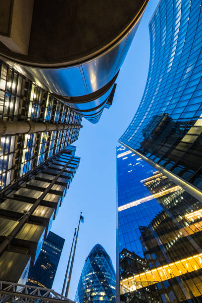 istock London dramatic low angle view futuristic City skyscrapers illuminated dusk 2165861175