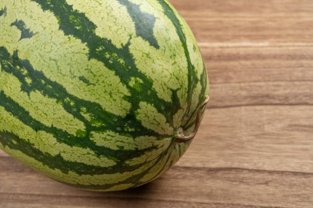 fresh watermelon on wood background at horizontal composition