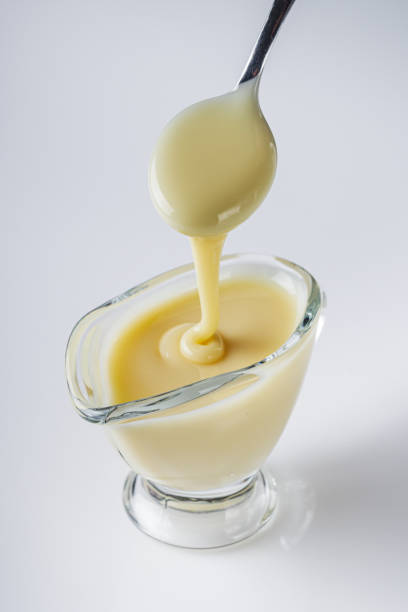 istock fresh sweet condensed milk on a white background 2165862453