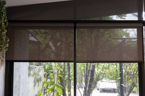 istock A window with a black blind curtain that is hanging down. 2165866960