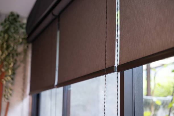istock A window with a black blind curtain that is hanging down 2165866965