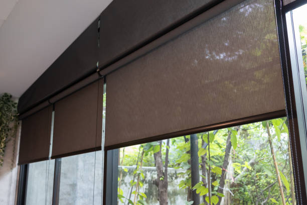 istock A window with a black blind curtain that is hanging down. 2165866967