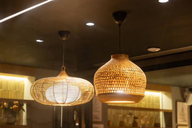 istock Two lamps hanging from the ceiling, one is a white lamp. handmade weaving bamboo lanterns. 2165867008