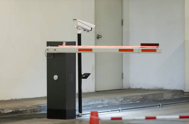 istock A red and white automatic traffic barrier with light and a camera on top of it. 2165867034