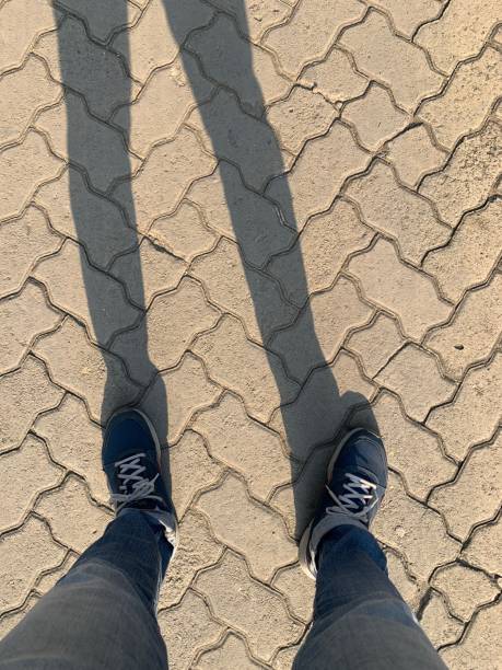 istock Men’s shadow under the sunshine in Indonesia 2165867079