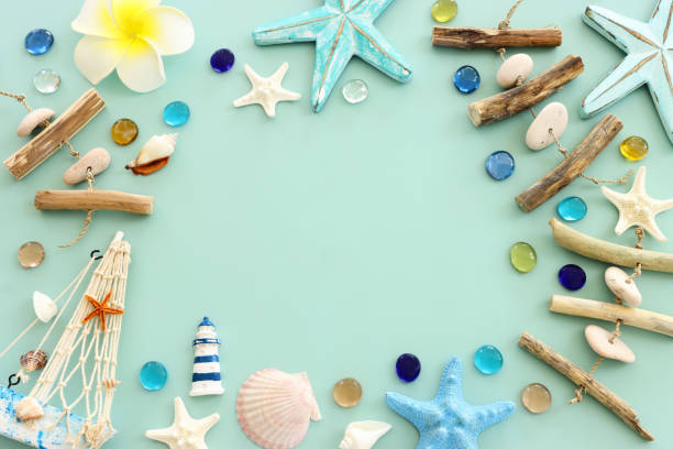 istock nautical concept with starfish and seashells over pastel mint background 2165868300