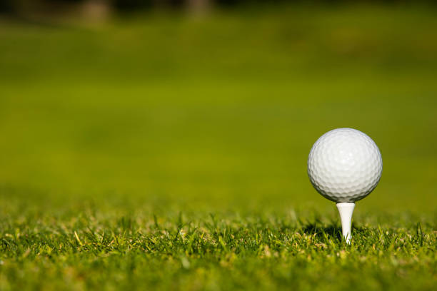 istock Golf ball and clubs in golf field 2165869165