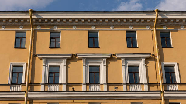 istock A bright yellow building stands out vividly against a blue sky backdrop 2165869194
