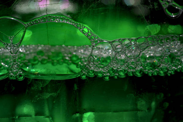 Abstract background, green liquid with foam.