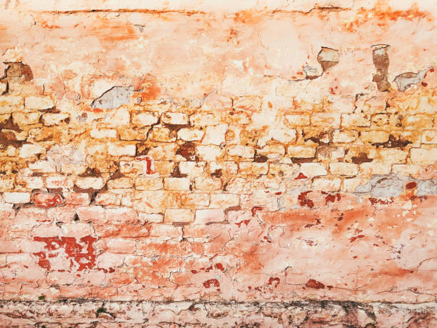 istock Grunge wall background, bricks and plaster with paint peeling off for interior or exterior design backdrop 2165872693