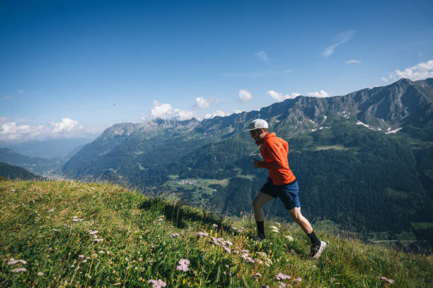 istock Trail runner bounds along mountain trail 2165872729