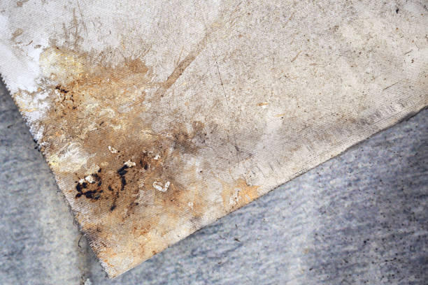 Dirty old torn poster paper with stains as background
