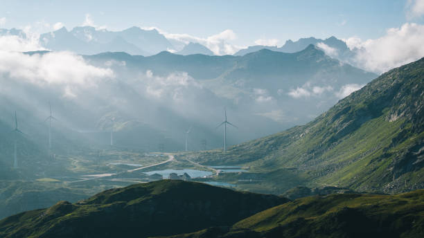Elevated view of mountain ranges, lake and mist