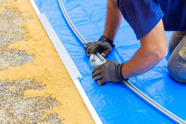 istock An above ground pool frame is being assembled by a worker 2165876572