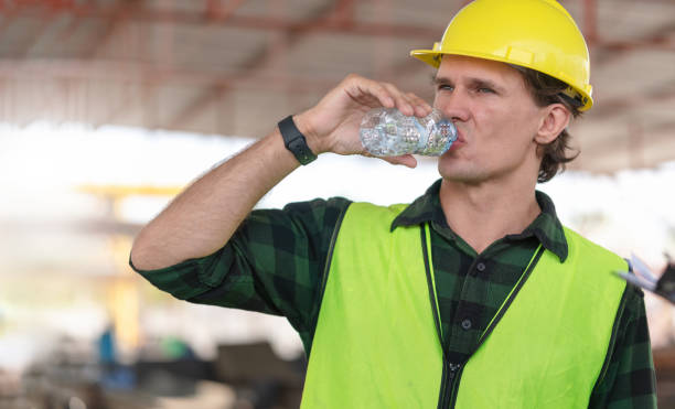 istock Engineer man drinking water at the precast factory site, Worker man drinking water at construction site 2165876971