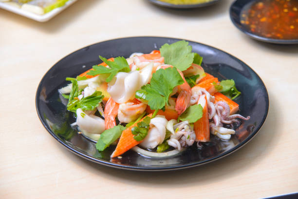 istock Spicy mixed seafood salad on the white background. 2165877489