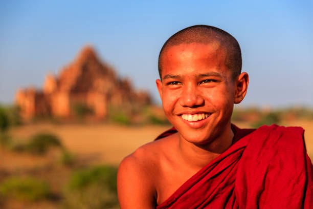 istock Young Buddhist monks resting on the temple, Myanmar 2165878119