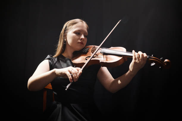 istock Young Violin Player Concentrating on Music Performance 2165879020