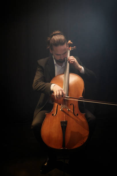 istock Professional Cellist Performing on Stage During Solo Concert 2165879022