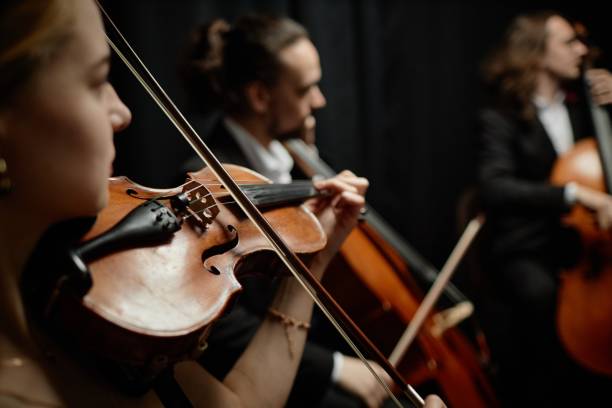 istock Classical Music Artist Playing Violin in Recording Studio 2165879053