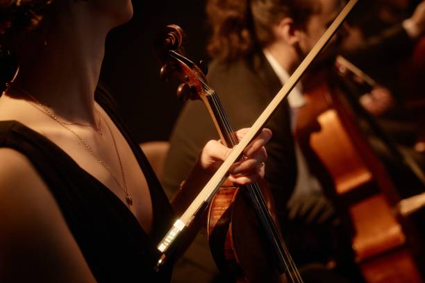 istock Violin Player Preparing for Concert on Stage 2165879078