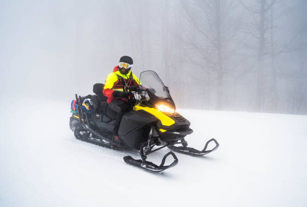 istock Man on a quad bike on a snowy mountain 2165883253