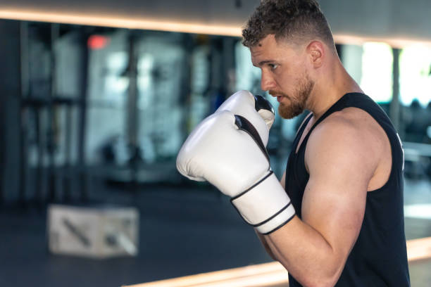istock Working boxer in boxing gloves. A boxer in training. 2165884304