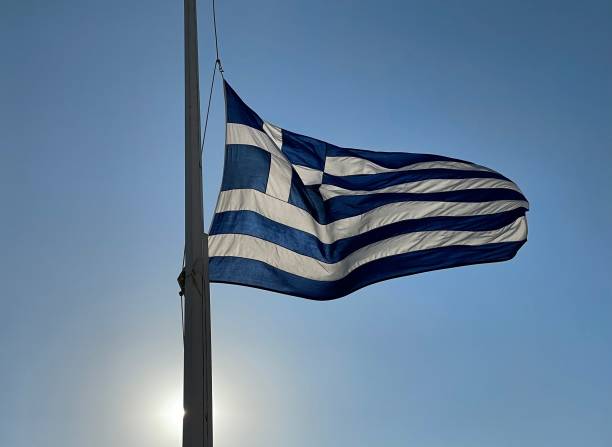 istock Greek flag on windy day with sun 2165884739