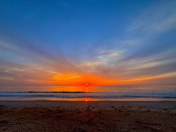 istock Wide angle red and blue sunrise on Florida beach 2165885244