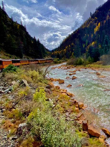 istock Silverton Durango narrow gauge train near river Colorado 2165885378