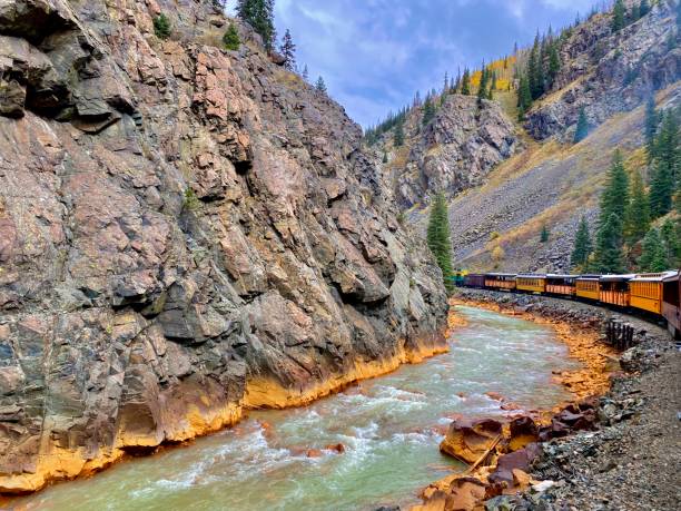 istock Durango silverton narrow gauge train next to animas river Colorado 2165885398