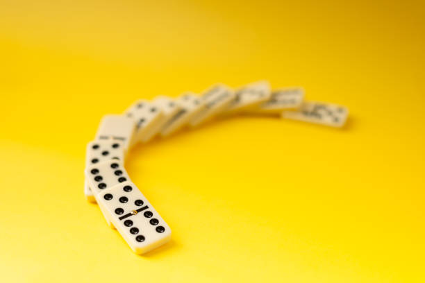 istock Dominoes on a yellow background. 2165887633