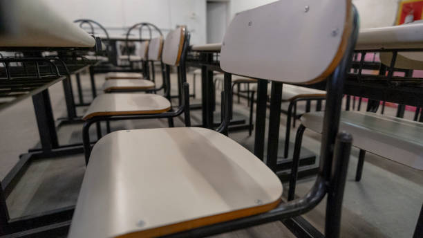 istock Classroom tables and chairs and very old chairs 2165888237