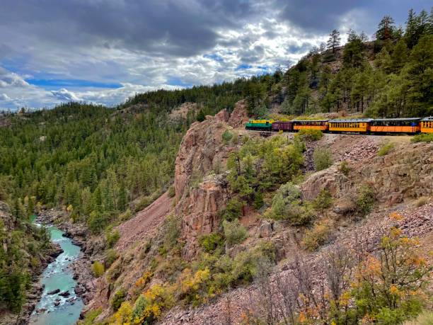 istock Durango to silverton narrow gauge train on cliffside with San Juan river 2165889255