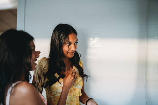 istock Two young women sharing a moment talking and smiling 2165889710