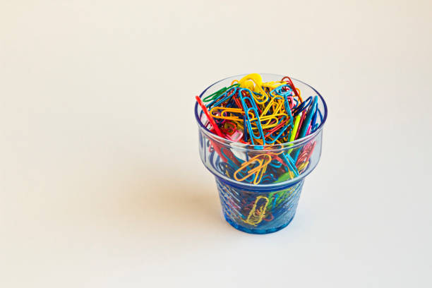 istock Colorful paperclips in glass 2165894638
