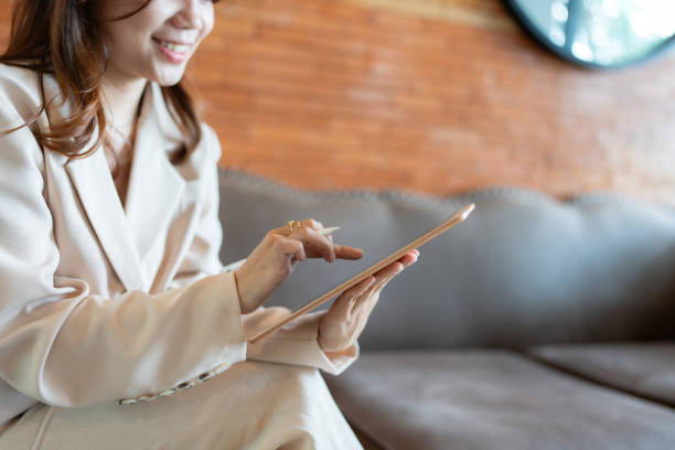 istock The female executive seamlessly integrated her laptop into her office workflow, using it to communicate with clients and handle business transactions with remarkable efficiency. 2165898826