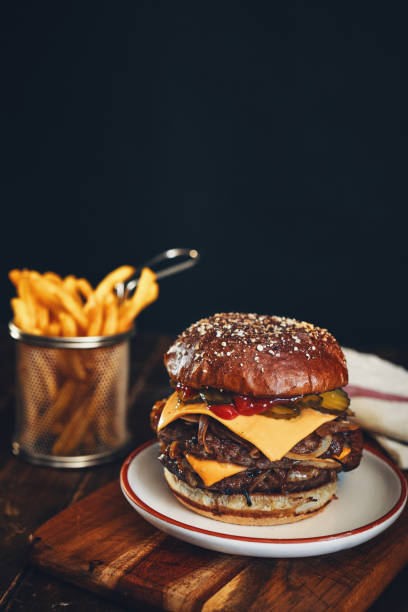 istock Double BBQ Burger with French Fries 2165899814