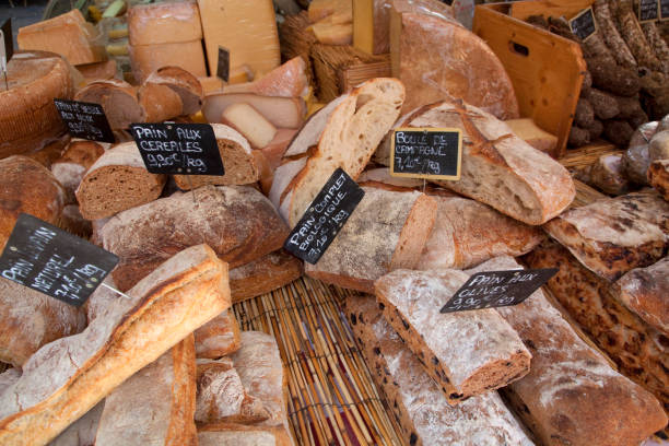 istock Variety of breads in bakery window 2165900499