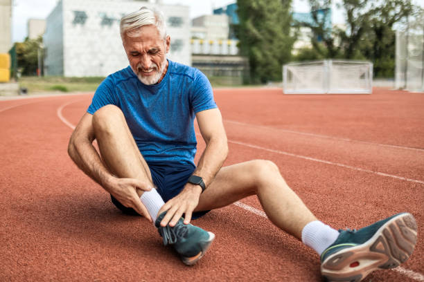 istock Senior Athlete Injured on Running Track 2165900703