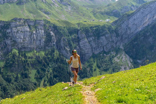 istock Woman Hiking on Mountain Path with Stunning Views 2165901432